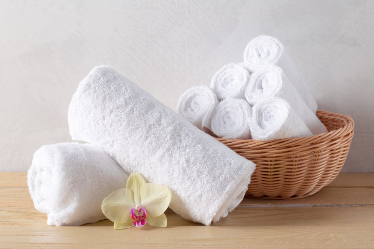 Soft white bath towels supplied by a trusted uniform supplier